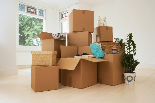 Moving boxes and furniture prepared for Sutton storage